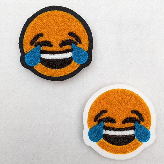 Chenille patch of tears and laughing emoji.
