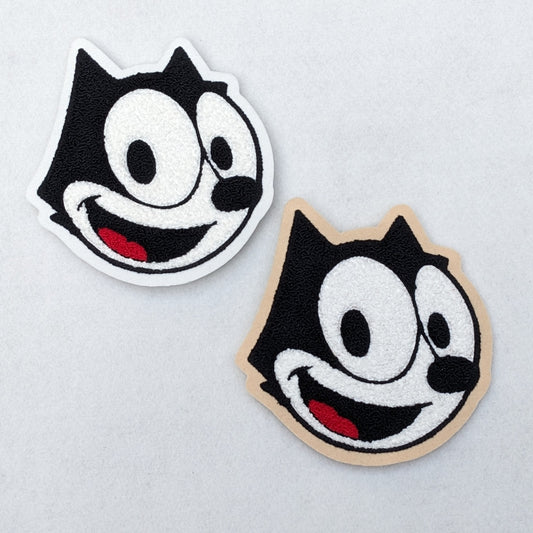 Whimsical chenille embroidered patch of Felix the Cat on scrim felt. Kawaii cute, cartoon  character.