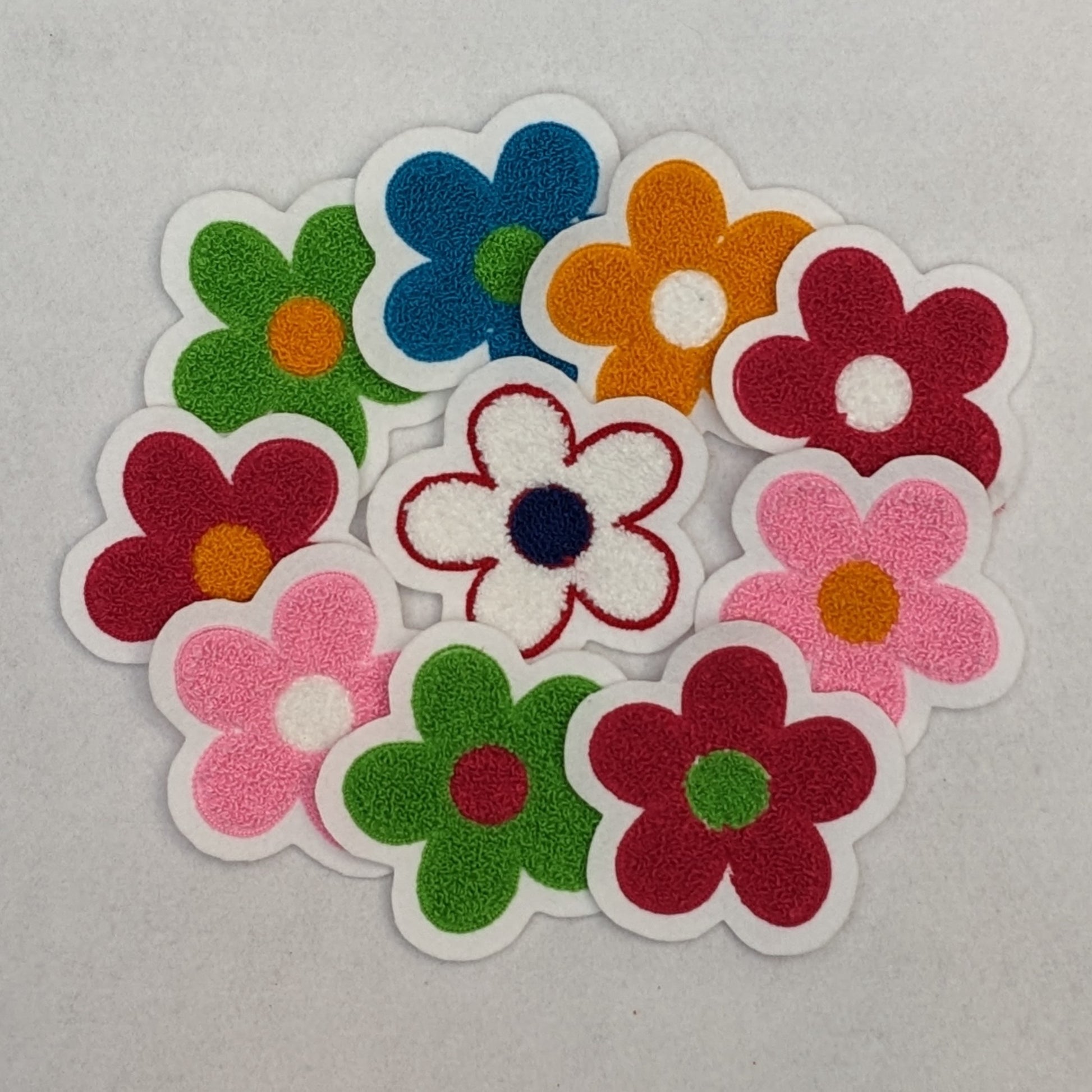 Flower Power! Chenille daisy patches in a variety of colors.